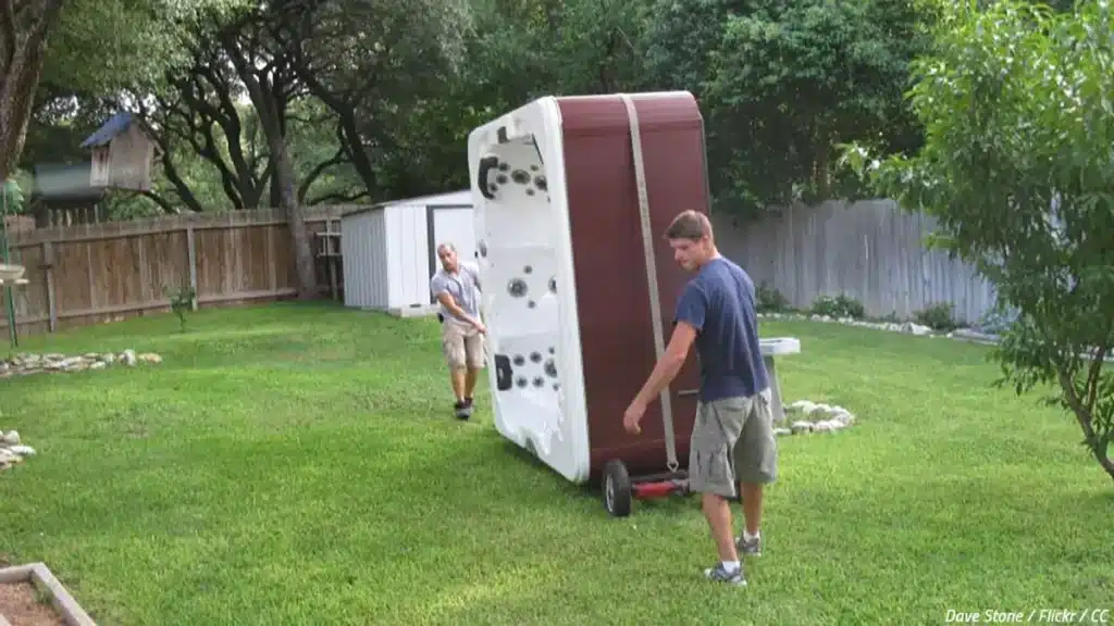 2 hot tub movers working